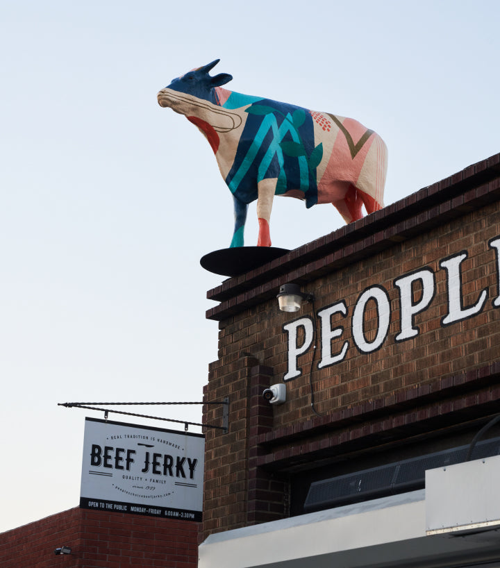 Image of a cow statue on top of a building in downtown Los Angeles